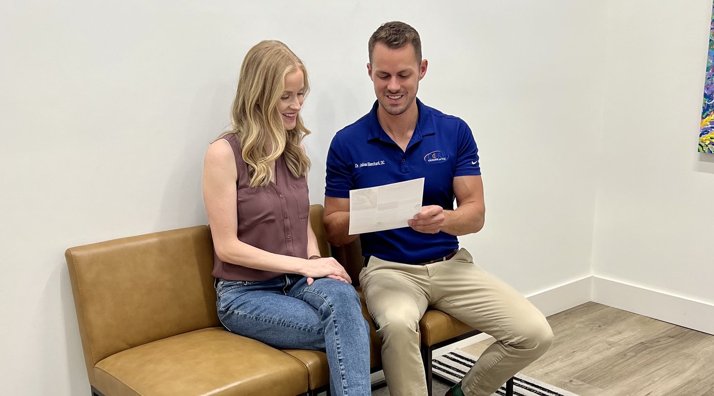 Dr. Josh Blanchard reviewing a treatment plan with a patient